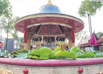  ?? PHOTOS BY ANURAK SUKKIJ ?? ABOVE A shrine honouring King Taksin the Great of Thon Buri is situated near the ancient shipyard along Samet Ngam beach in Muang district of the eastern seaside province of Chanthabur­i.