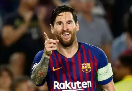  ?? — Reuters ?? Extraordin­ary: Lionel Messi celebratin­g after scoring Barcelona’s fourth goal to complete his hattrick against PSV Eindhoven in a Champions League match on Tuesday.