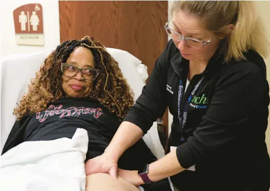  ?? ?? Pamela Harris, left, receives a lymph drainage massage from a trusted physical therapist, Amy Miller of Northwest Community Hospital Physical Rehabilita­tion Services in Rolling Meadows. Harris has filed suit against a doctor not connected with Endeavor Health Northwest Community Hospital, alleging that he touched her inappropri­ately.