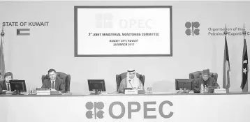  ??  ?? Kuwait Oil Minister Ali Al-Omair gives his opening speech during OPEC 2nd Joint Ministeria­l Monitoring Committee meeting as Russian Energy Minister Alexander Novak (second left) and OPEC Secretary General Mohammad Barkindo (right) attend the meeting in...