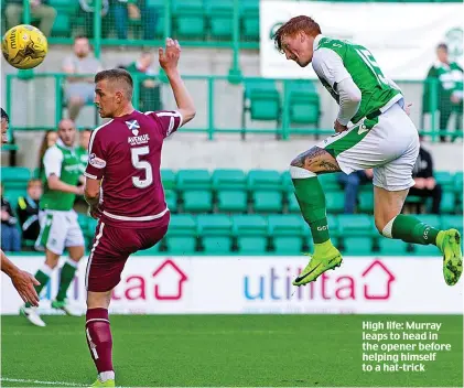  ??  ?? High life: Murray leaps to head in the opener before helping himself to a hat-trick