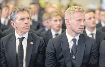  ??  ?? Leicester City manager Claude Puel, left, and goalkeeper Kasper Schmeichel attend the funeral for club owner Vichai Srivaddhan­aprabha in Bangkok.