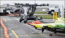  ?? ?? The Springfiel­d-Beckley Municipal Airport hosted the 2021 Ohio Advanced Air Mobility Showcase on Nov. 10. Companies in the field of flying cars showcased their work for local and national officials.