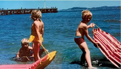  ??  ?? Summer fun sorted: a lilo and a few gentle waves at Petone.