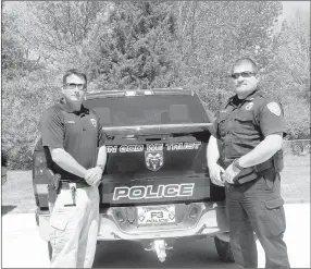  ?? LYNN KUTTER ENTERPRISE-LEADER ?? Chad Parrish, school resource officer, left, has been promoted to lieutenant and Mike Wilbanks has been promoted from patrol sergeant to captain. The promotions are several changes made by Farmington Police Chief Brian Hubbard.