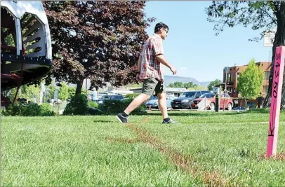  ?? JOE FRIES/Penticton Herald ?? The stake pictured has been hammered into the ground near the SS Sicamous at 343.5 metres above sea level, the height to which waves on Okanagan Lake are expected to reach. The pink line in front of the stake indicates where workers were expected...