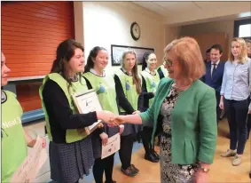  ??  ?? Minister O’Sullivan greeting An Taisce Neat Street team from St. Mary’s last week.