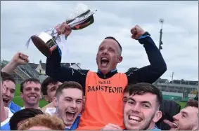  ??  ?? Joe Fortune celebratin­g with the cup after Dublin’s Leinster Under-21 win of 2016.