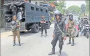  ?? AP ?? ▪ Sri Lankan police officers stand guard in Ambatenna.