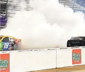  ?? C. TILTON/ NASCAR GETTY IMAGES JARED ?? Kevin Harvick, right, saw his championsh­ip hopes go up in smoke on the final lap at Martinsvil­le Speedway after making contact with Kyle Busch’s No. 18 Toyota.