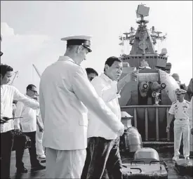  ??  ?? President Duterte is given a tour of the Russian guided missile cruiser 'Varyag' that arrived in Manila yesterday for a four-day goodwill visit.