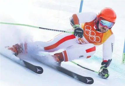  ?? Picture / AP ?? Marcel Hirscher on his way to victory in the giant slalom.