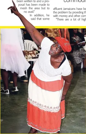  ?? LIONEL ROOKWOOD ?? The Holy Ghost was in the air, and this woman was definitely feeling the Spirit during the praise and worship session at the 13th Annual Heal The Family, Heal The Nation event held at the National Arena, yesterday.