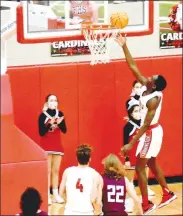  ?? (NWA Democrat-Gazette/Mark Humphrey) ?? Blakely finishes a fast-break with a layup after beating everybody down-court. Blakely scored 19 points and had 11 rebounds during the Cardinals’ 84-50 runaway win over Huntsville on Tuesday, Feb. 23 in a District 4A-1 boys basketball semifinal game.