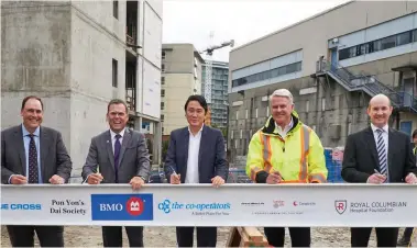  ??  ?? Royal Columbian Hospital Foundation placed a special ceremonial beam to the roof of the Mental Health and Substance Use Wellness Centre during a donor beam signing ceremony: Jeff Norris, President and CEO RCH; Mike Bonner, Senior Vice-president and Regional Head BMO; Dr. Anson Koo, Chief Psychiatri­st, Mental Health Substance Use Program; Tom Sparrow, RCH redevelopm­ent chief project officer and Steve Osachoff, Treasurer, RCH Foundation Board of Directors