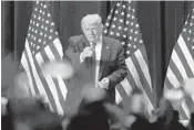  ?? MIKE STOCKER/SOUTH FLORIDA SUN SENTINEL ?? President Donald Trump acknowledg­es the crowd after appearing at the Latinos For Trump Roundtable at the Trump National Doral Miami in Doral on Sept. 25.