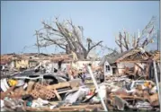  ??  ?? DEVASTATIO­N: Rescuers search through the rubble for survivors.