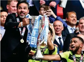  ?? SPORTIMAGE VIA PA ?? Lift: Wagner leads Hudderfiel­d to promotion in May