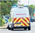  ??  ?? Police near the scene of the raid in Sussex