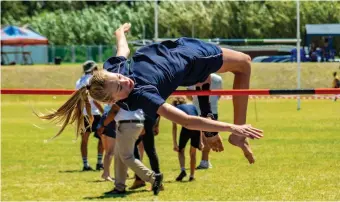  ?? Photos: Blake Linder ?? GBC athlete Hannah de Necker successful­ly clears the high jump bar.