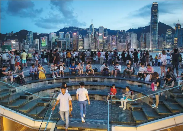  ?? PROVIDED TO CHINA DAILY ?? Visitors hang out at the Victoria Harbor in Tsim Sha Tsui, Hong Kong, in June 2017.