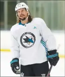  ?? Canadian Press photo ?? San Jose Sharks Erik Karlsson smiles as he skates during practice Friday in Ottawa.