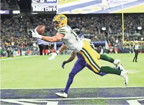  ?? TOMMY GILLIGAN/USA TODAY SPORTS ?? Packers wide receiver Allen Lazard tries to haul in a pass in the end zone Sunday against the Ravens. It would have been a record-setting touchdown for quarterbac­k Aaron Rodgers.