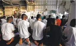  ?? AHMED HATEM AP ?? Migrants pray on the deck of the Geo Barents, a rescue vessel operated by Doctors Without Borders off Libya, in the central Mediterran­ean route.