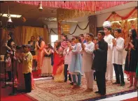  ??  ?? The youngest members of the Sri Narayan Hindu Temple in Yuba City perform a children’s prayer during Saturday’s celebratio­n.