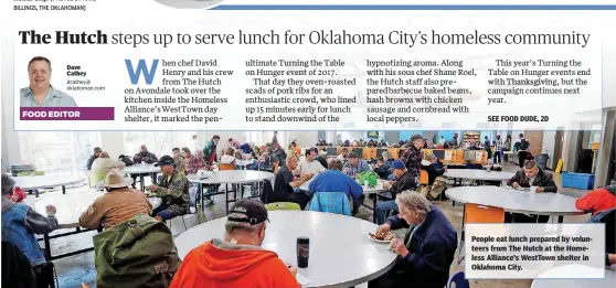  ??  ?? People eat lunch prepared by volunteers from The Hutch at the Homeless Alliance’s WestTown shelter in Oklahoma City.