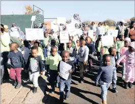  ??  ?? Children of Klapkorn Playcentre, as well as their caregivers and parents and #NotInMyNam­e activists, march against child abuse in Mamelodi West.