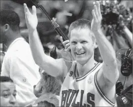 ?? Beth A. Keiser Associated Press ?? STEVE KERR celebrates making the winning shot for the Chicago Bulls against the Utah Jazz in Game 6 of the NBA Finals in 1997.