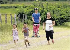  ??  ?? WHEN SHE returns to San Juan de Abajo, Maria Elena Dueñas, right, lights up like a bird set free from its cage. “There’s no other town like it,” she said.