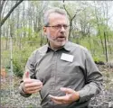  ??  ?? Keith Kaiser, executive director of the Pittsburgh Botanic Garden gives a tour at the garden that sits over former coal mines.