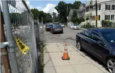  ?? JiM MicHAuD / Boston HerAlD ?? POLICE TAPE LEFT BEHIND: The area where a man was fatally wounded on in the area of 25 Regis Street in Mattapan, Sunday.