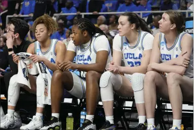  ?? MARY ALTAFFER — THE ASSOCIATED PRESS ?? UCLA players on the bench show their disappoint­ment as LSU pulls away in the fourth quarter to win their Sweet 16 game Saturday in Albany, N.Y.
