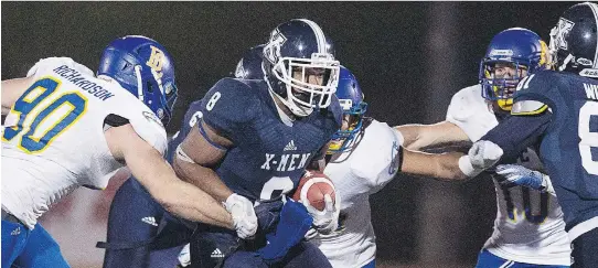  ?? ANDREW VAUGHAN/THE CANADIAN PRESS FILES ?? St. Francis Xavier X-Men back Ashton Dickson runs the ball against UBC in the Uteck Bowl in Antigonish, N.S., on Nov. 21, 2015.