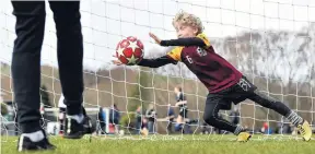  ??  ?? Warming up . . . Thomas O’Neil (9), from the Maori Hill Football Club, practises before a game yesterday.