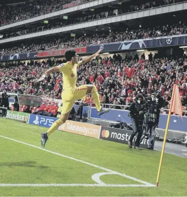  ?? ?? 0 Luis Diaz celebrates scoring Liverpool’s third goal in the quarter-final first leg against Benfica