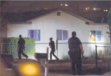  ?? Gina Ferazzi Los Angeles Times ?? POLICE OFFICERS search for a reported gunman in San Bernardino in August 2016. The struggling city had 62 homicides in 2016, a 41% increase from 2015 and the deadliest year in San Bernardino since 1995.