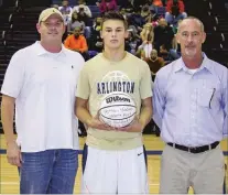  ??  ?? Left: Arlington’s Nathan Hoover, received his 1,000th point ball award earlier this season. Pictured with Nathan is his father, Sammy Hoover (lef t), and Arlington head coach Don Deaton.