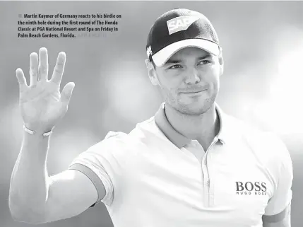  ?? AFP PHOTO ?? Martin Kaymer of Germany reacts to his birdie on the ninth hole during the first round of The Honda Classic at PGA National Resort and Spa on Friday in Palm Beach Gardens, Florida.