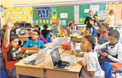  ?? AMY DAVIS/BALTIMORE SUN PHOTOS ?? Clockwise from left, third-graders Jonathan Alfaro, David Lamkin, Carter Butler, Jordan Felipa, Felix Ouedraogo, and Kimora Lea at Bedford Elementary School. While still a small percentage of the school’s population, Bedford’s immigrant numbers are growing.