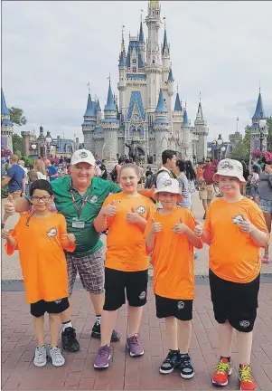  ?? SUBMITTED PHOTO/DON VATERS ?? From left, John-Ryan Christmas, Don Vaters, Halle Gould, Christophe­r Frison and Zackary McPhee are seen standing in front of Cinderella Castle at Walt Disney World in Orlando, Fla. The children visited Walt Disney World this week as part of the Dreams...