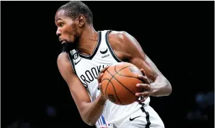  ?? JULIA NIKHINSON — THE ASSOCIATED PRESS ?? Brooklyn Nets forward Kevin Durant handles the ball during last Monday’s preseason game against the Sixers in New York.