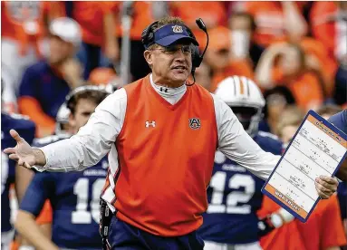  ?? BUTCH DILL / AP ?? Gus Malzahn led Auburn to wins over both of the College Football Playoff finalists last season and earned himself a big payday in the process. Now those same teams, Georgia and Alabama, could earn Malzahn a buyout from his big deal.