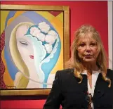  ?? ALBERTO PEZZALI — THE ASSOCIATED PRESS ?? Pattie Boyd poses next to the original artwork by E. Frandsen De Schomberg, used for the cover of Derek and the Dominoes album ‘Layla and Other Assorted Love Songs’ as part of The Pattie Boyd Collection at Christie’s, in London.