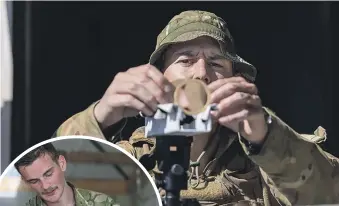  ?? ADELE RYCROFT/MANAWATŪ STANDARD ?? An electrical technician builds an optical scope to identify a target 200 metres away at the New Zealand Defence Force’s three-day trade competitio­n. Inset: An armourer inspects a cache of weapons.