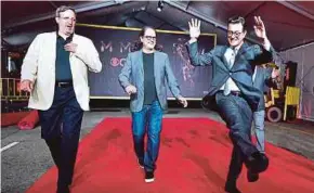  ?? AFP PIC ?? Emmy Awards host Stephen Colbert (right) is joined by Television Academy officials for the red carpet rollout in Los Angeles recently.