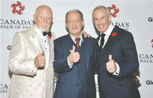  ?? GEORGE PIMENTEL / WIREIMAGE FILES ?? Rex Murphy, flanked by former Coach's Corner co-hosts Don Cherry and Ron MacLean at the 2015 Canada's Walk Of Fame Awards in Toronto, proposed Cherry should serve as Canada's governor general. “It has been a Chardonnay era at Rideau Hall,” he wrote. “It's time for some beer.”